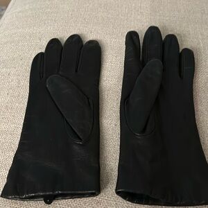 Women’s black leather gloves.